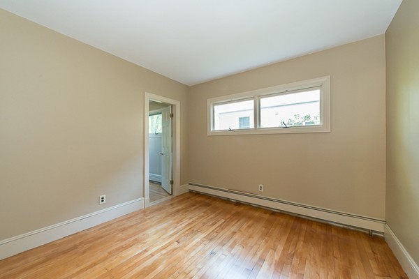 39 Farmcrest Avenue Lexington, MA 02421 - Photo 13 of 26 wooden floor and window in an empty room