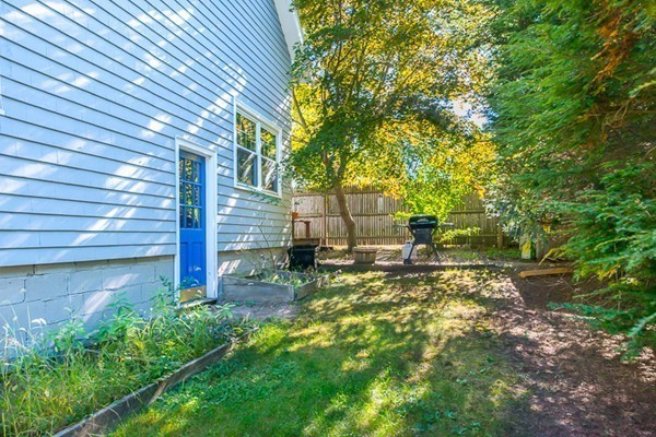39 Farmcrest Avenue Lexington, MA 02421 - Photo 24 of 26 a view of a backyard with plants and large tree
