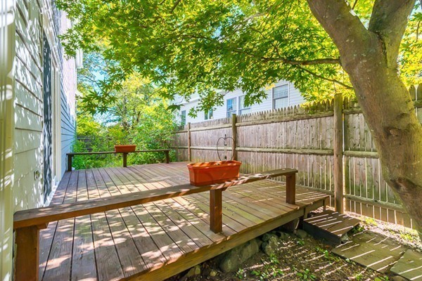 39 Farmcrest Avenue Lexington, MA 02421 - Photo 25 of 26 a view of a wooden deck with a bench