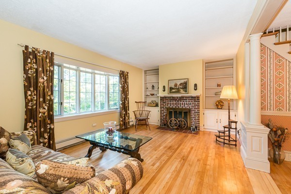 39 Farmcrest Avenue Lexington, MA 02421 - Photo 6 of 26 a spacious bedroom with a bed and a fireplace