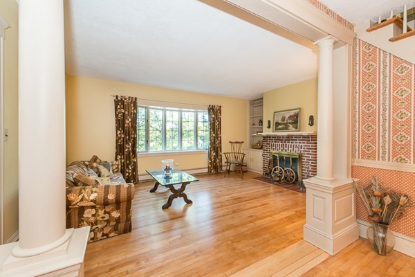 39 Farmcrest Avenue Lexington, MA 02421 - Photo 7 of 26 a living room with furniture and a fireplace