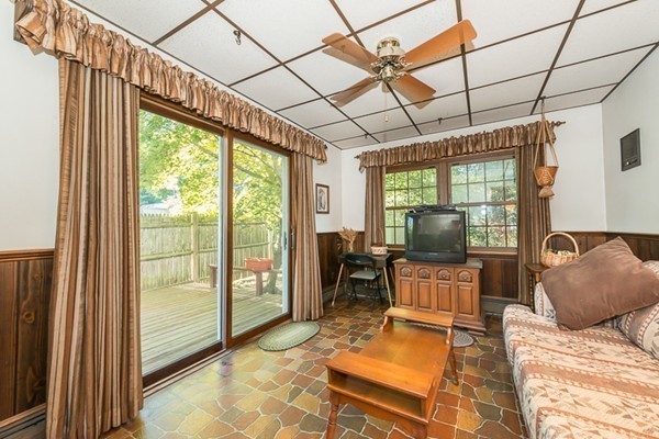 39 Farmcrest Avenue Lexington, MA 02421 - Photo 8 of 26 a living room with furniture and a flat screen tv