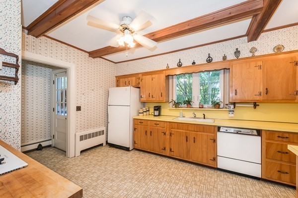 39 Farmcrest Avenue Lexington, MA 02421 - Photo 10 of 26 a large white kitchen with a window and refrigerator