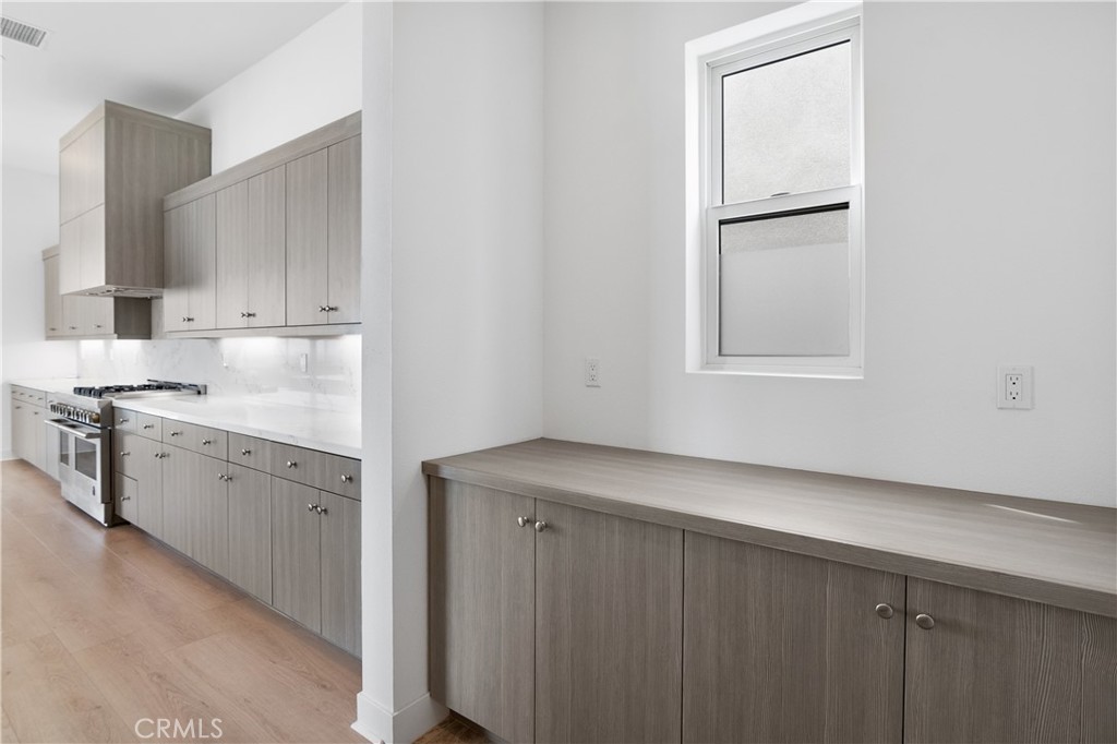 11734 Hillsborough Lane Porter Ranch, CA 91326 - Photo 14 of 34 a view of cabinets and wooden floor