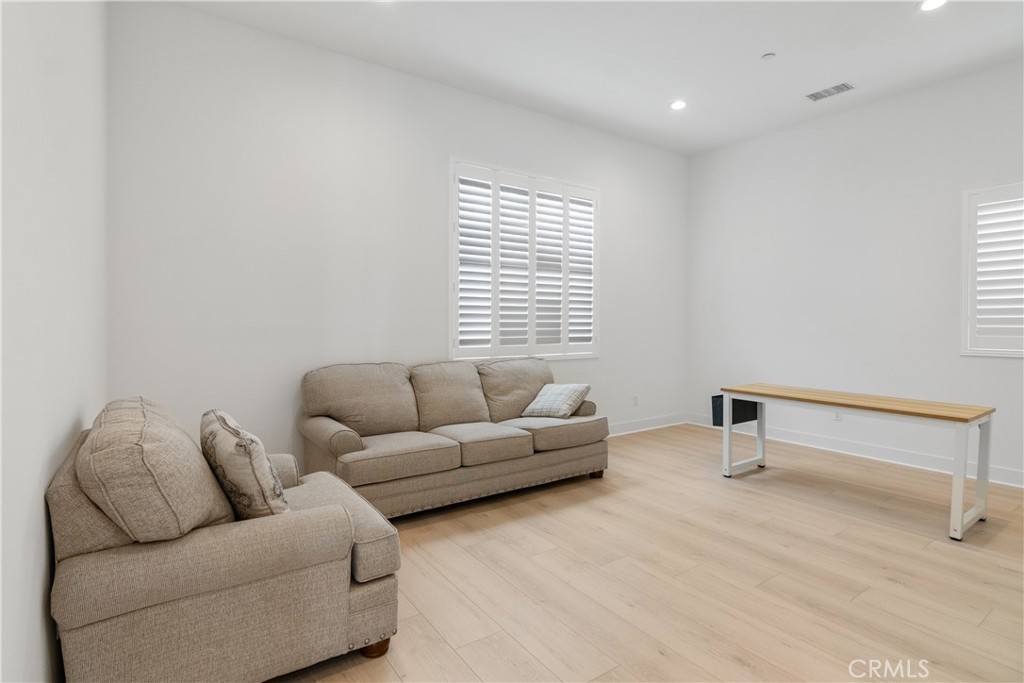 11734 Hillsborough Lane Porter Ranch, CA 91326 - Photo 16 of 34 a living room with furniture and a window