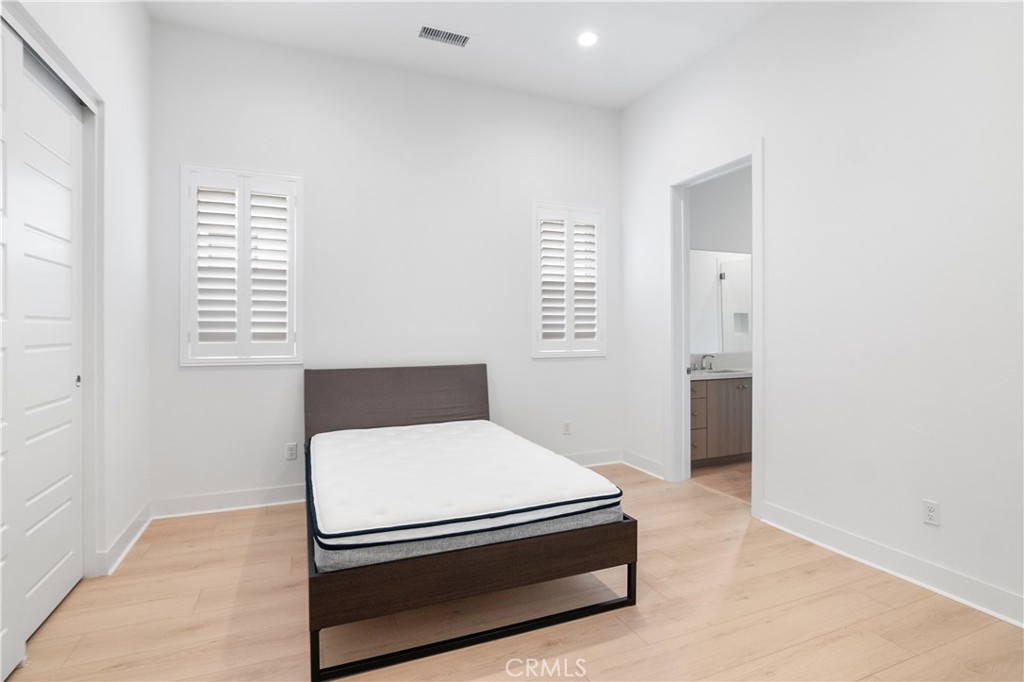 11734 Hillsborough Lane Porter Ranch, CA 91326 - Photo 17 of 34 a room with a bed and a window