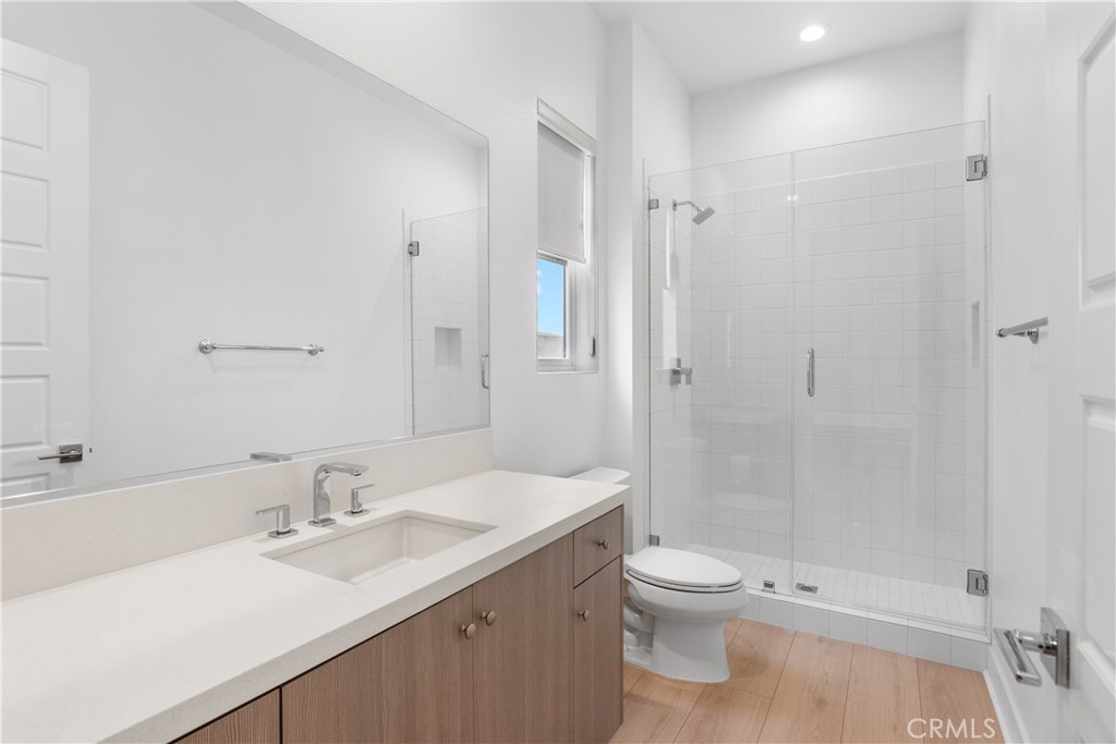 11734 Hillsborough Lane Porter Ranch, CA 91326 - Photo 18 of 34 a bathroom with a sink a toilet and shower
