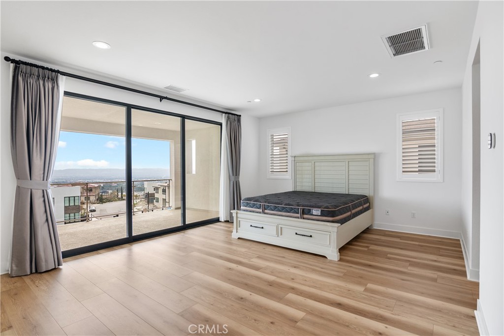 11734 Hillsborough Lane Porter Ranch, CA 91326 - Photo 21 of 34 a kitchen with stainless steel appliances granite countertop a stove and a refrigerator