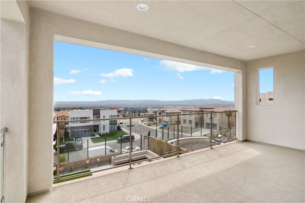 11734 Hillsborough Lane Porter Ranch, CA 91326 - Photo 22 of 34 a view of a balcony with a floor to ceiling window and kitchen