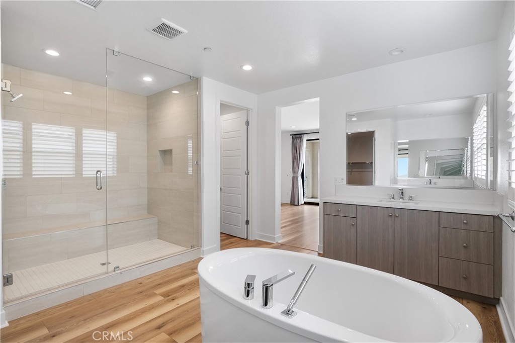 11734 Hillsborough Lane Porter Ranch, CA 91326 - Photo 25 of 34 a bathroom with a bathtub and a shower