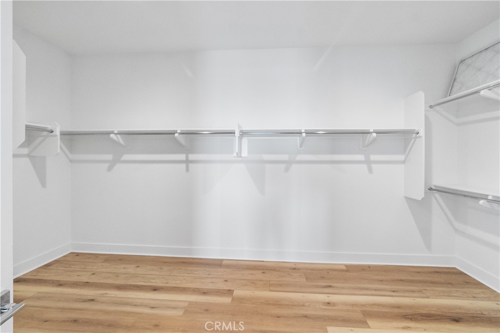 11734 Hillsborough Lane Porter Ranch, CA 91326 - Photo 26 of 34 a view of an empty walk in closet