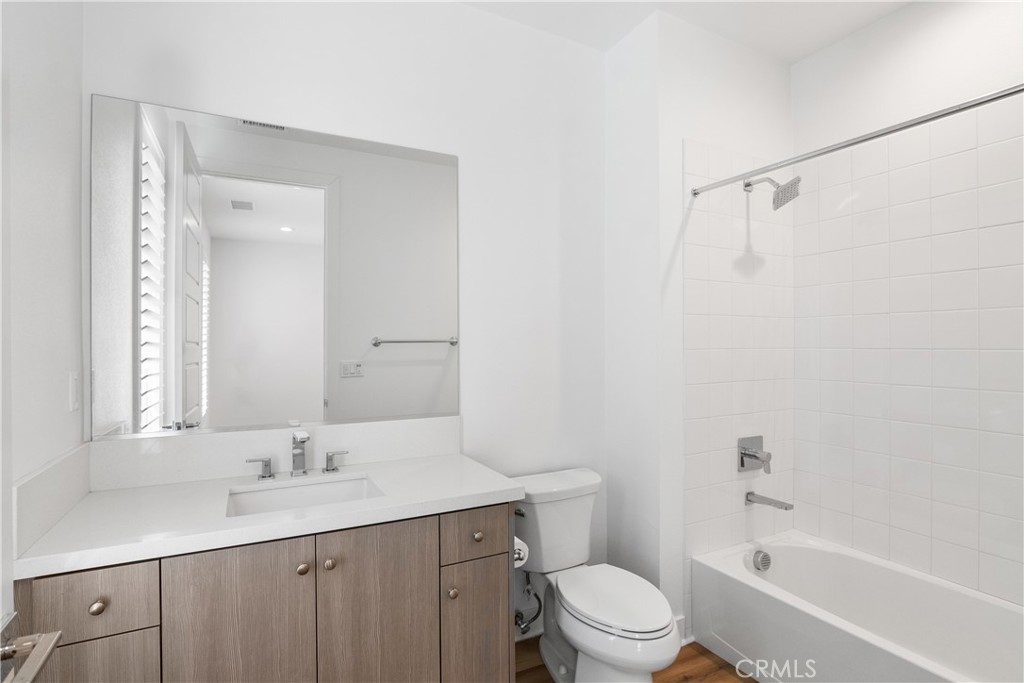11734 Hillsborough Lane Porter Ranch, CA 91326 - Photo 29 of 34 a bathroom with a sink a toilet and shower