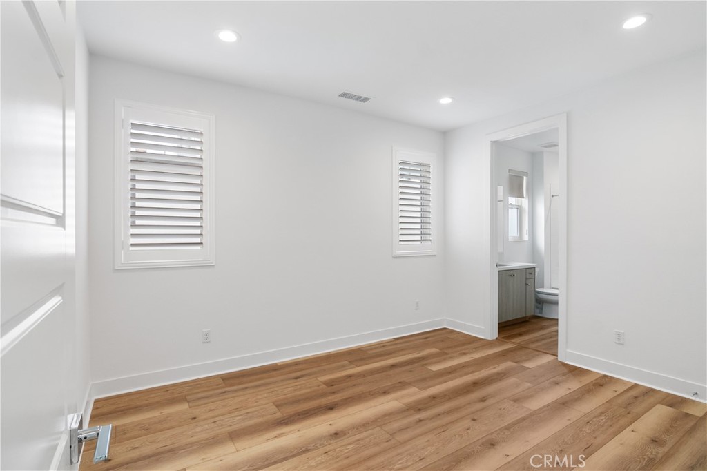 11734 Hillsborough Lane Porter Ranch, CA 91326 - Photo 33 of 34 a view of empty room with wooden floor and fan