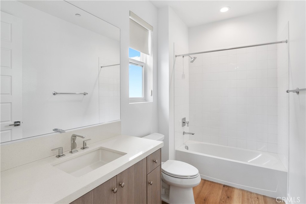 11734 Hillsborough Lane Porter Ranch, CA 91326 - Photo 34 of 34 a bathroom with a sink mirror toilet and bathtub