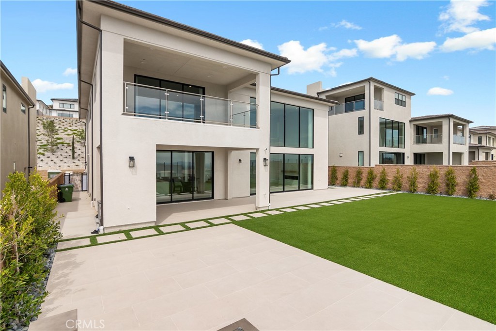 11734 Hillsborough Lane Porter Ranch, CA 91326 - Photo 4 of 34 a view of a house with a yard and plants