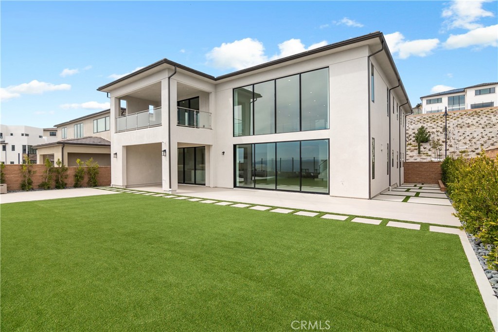 11734 Hillsborough Lane Porter Ranch, CA 91326 - Photo 5 of 34 a front view of a house with a yard