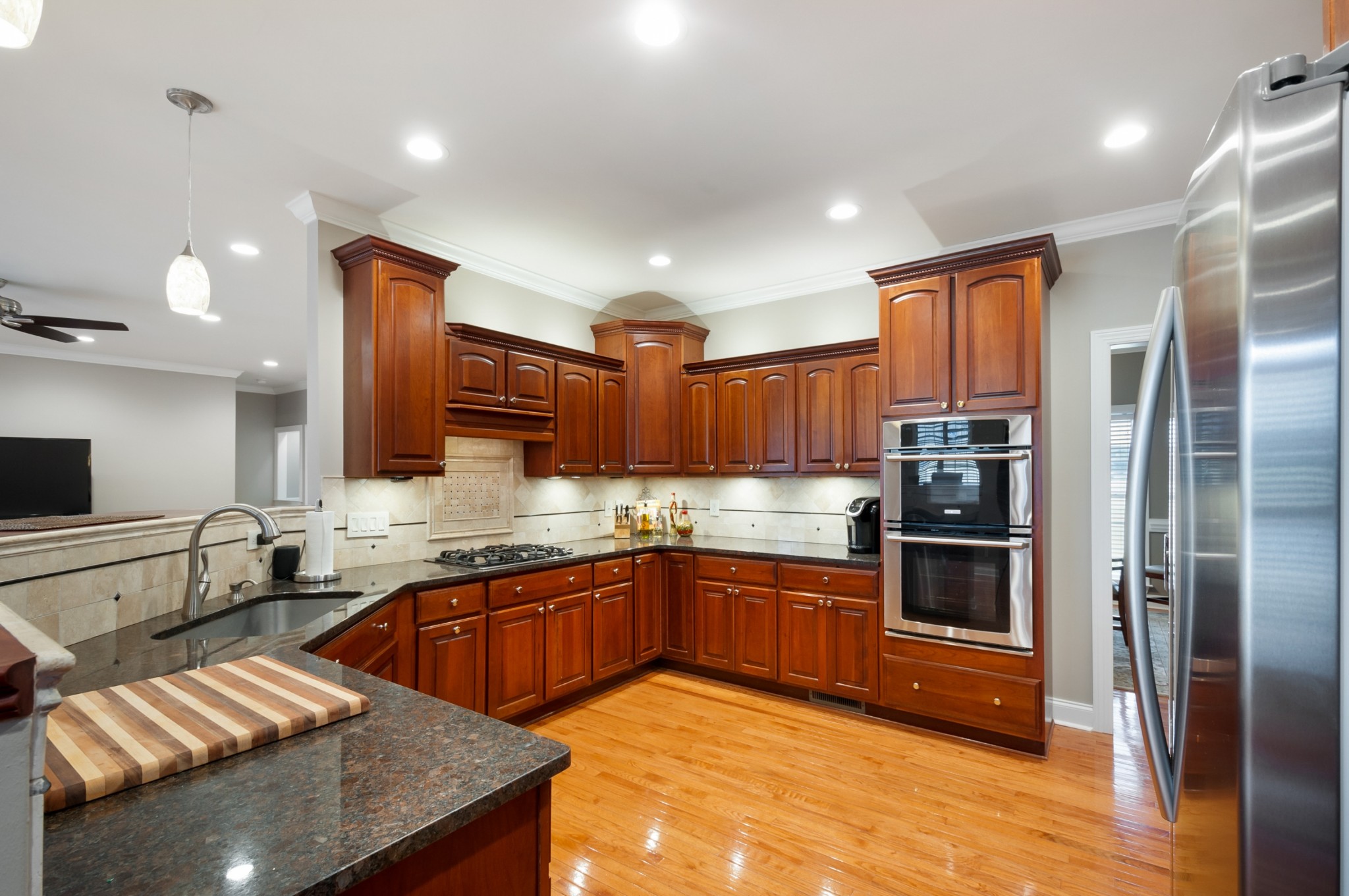 876 Baker Road Columbia, TN 38401 - Photo 12 of 48 a kitchen with stainless steel appliances granite countertop a sink stove and refrigerator