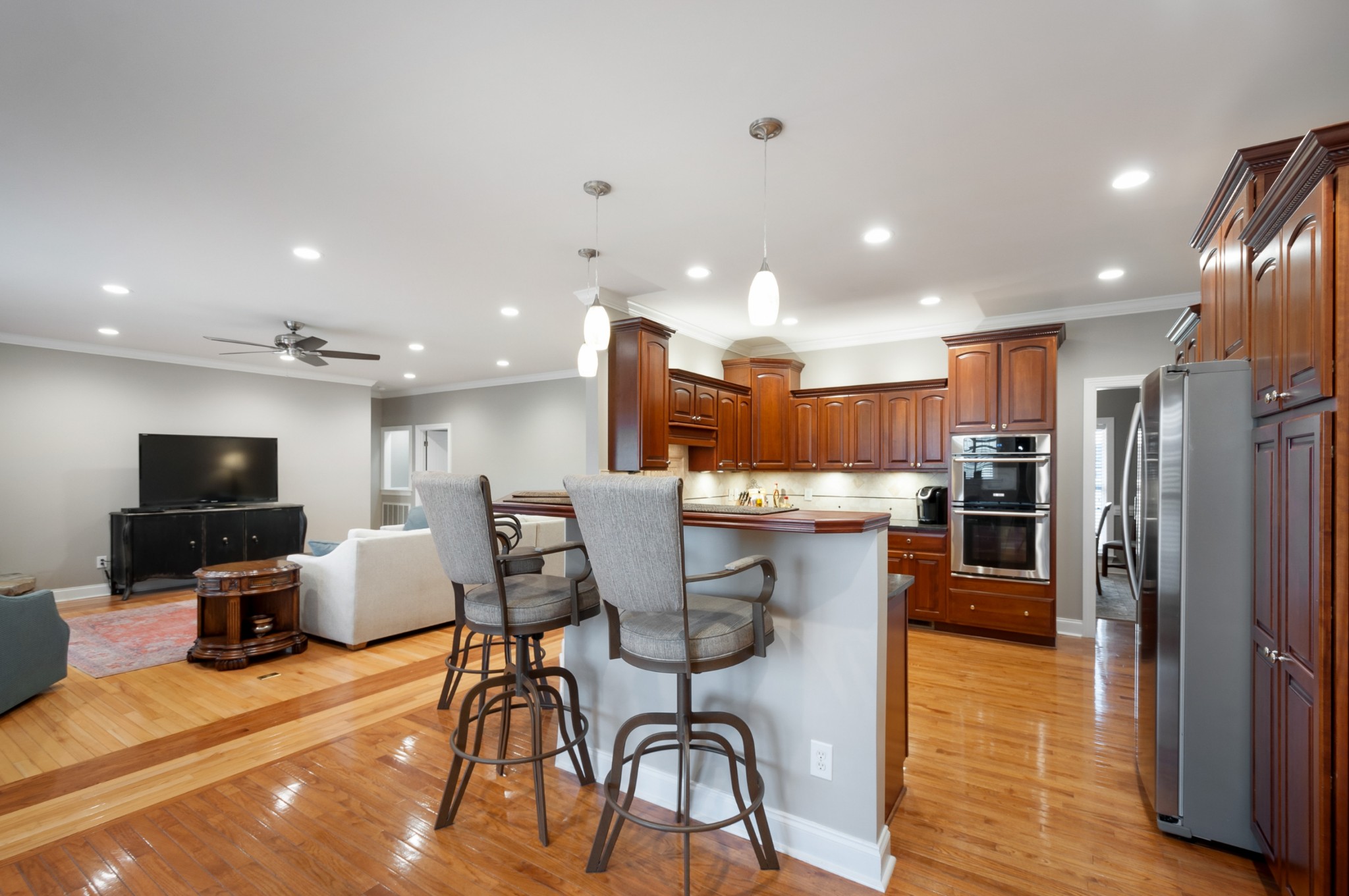 876 Baker Road Columbia, TN 38401 - Photo 13 of 48 a kitchen with stainless steel appliances kitchen island granite countertop a refrigerator and microwave