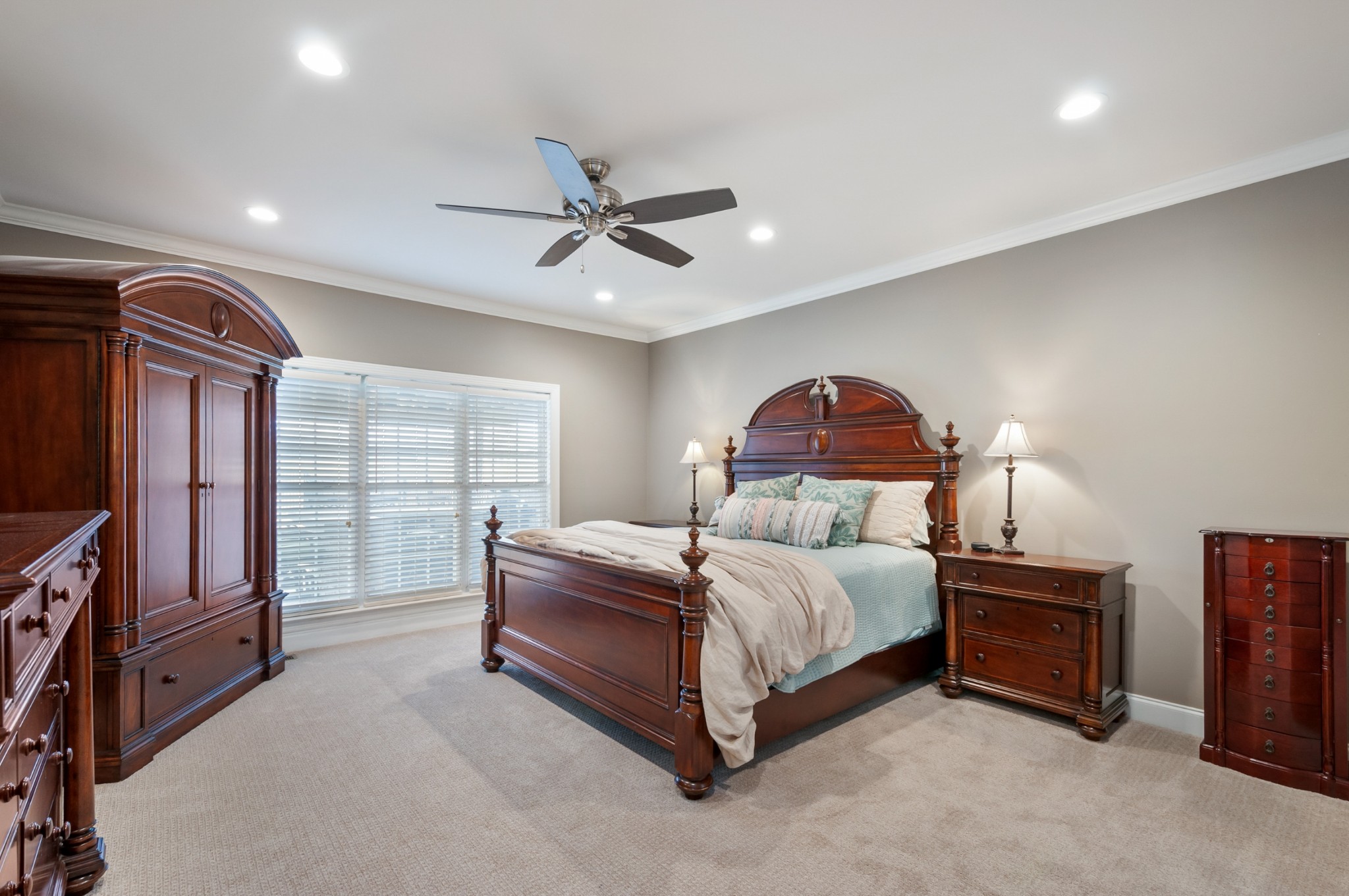 876 Baker Road Columbia, TN 38401 - Photo 19 of 48 a spacious bedroom with a bed and a chandelier
