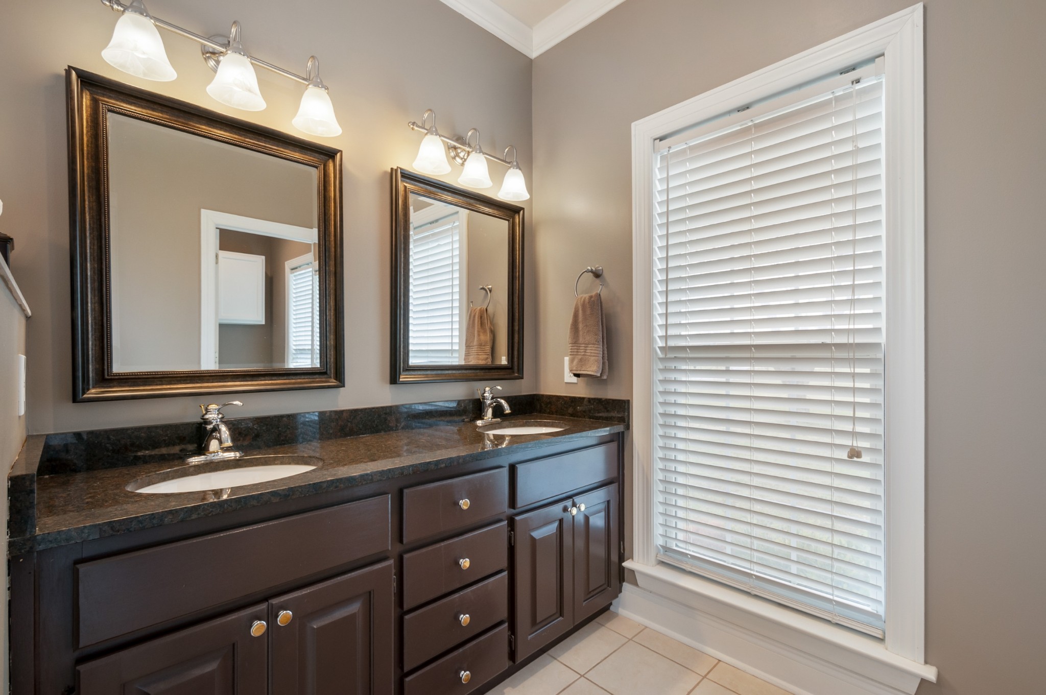 876 Baker Road Columbia, TN 38401 - Photo 23 of 48 a bathroom with a double vanity sink and a mirror