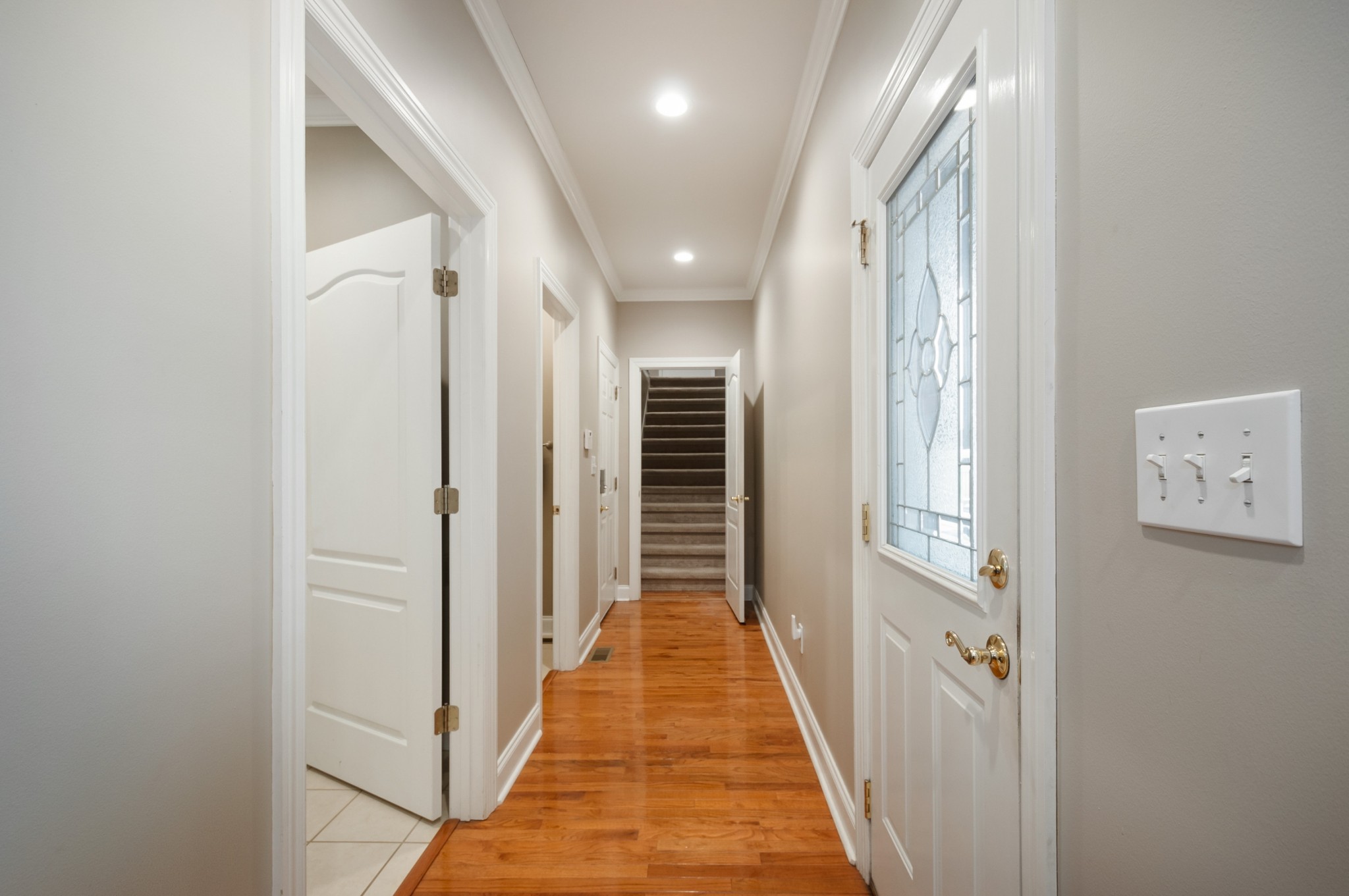 876 Baker Road Columbia, TN 38401 - Photo 25 of 48 a view of a hallway with wooden floor and staircase