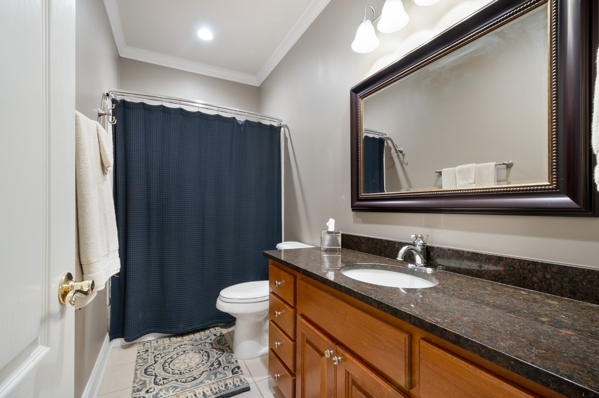 876 Baker Road Columbia, TN 38401 - Photo 31 of 48 a bathroom with a sink a toilet a mirror and shower