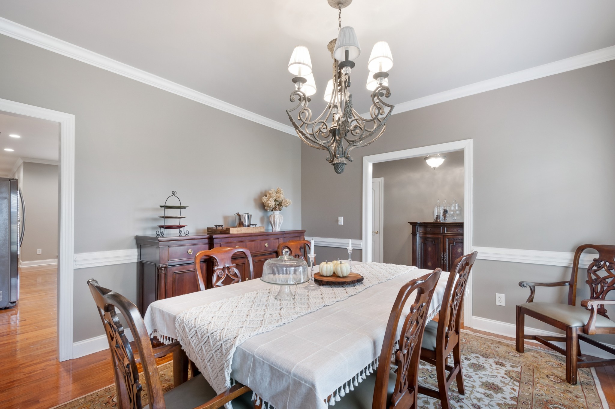 876 Baker Road Columbia, TN 38401 - Photo 9 of 48 a view of a dining room with furniture a chandelier and wooden floor