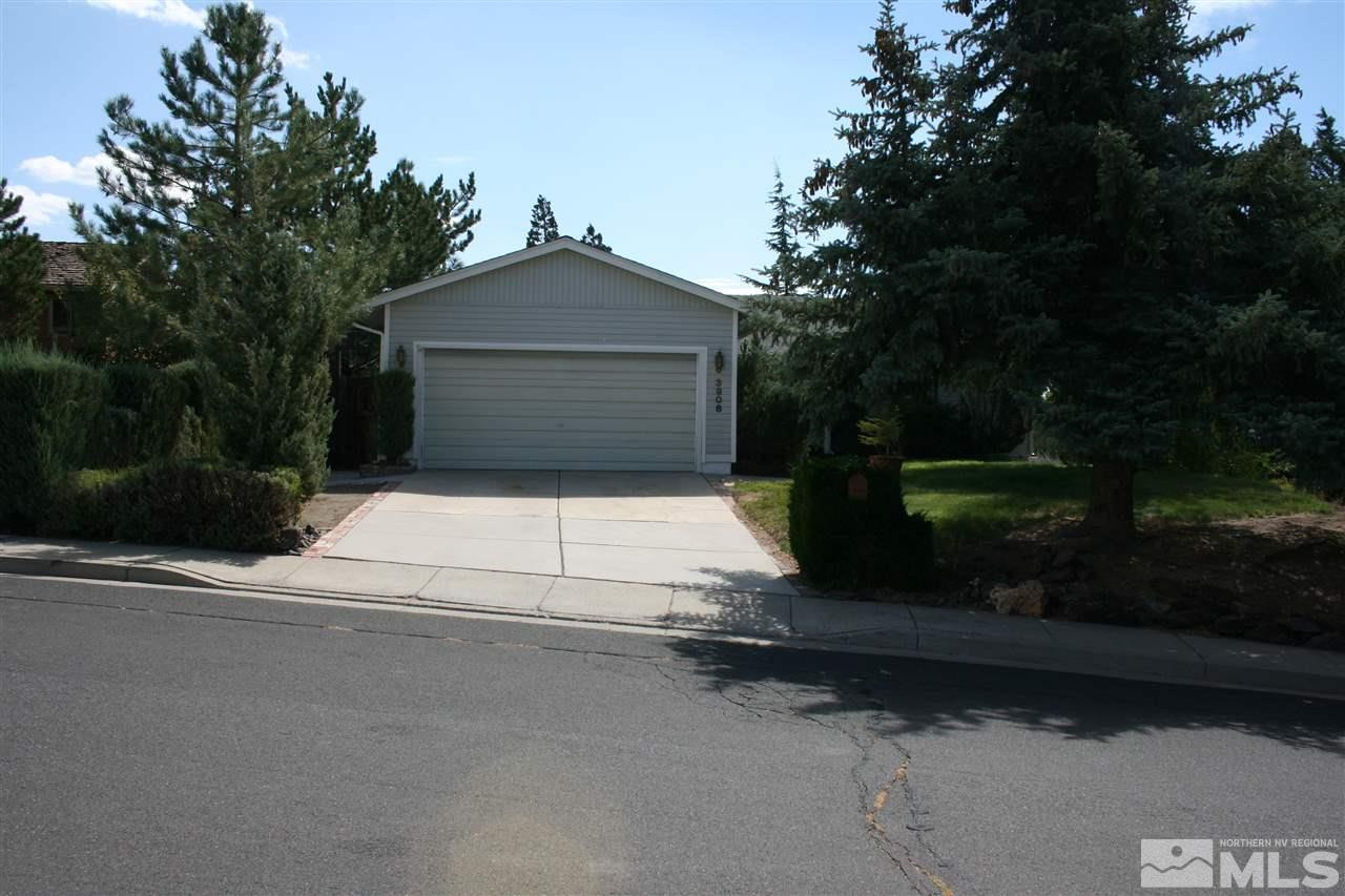 3908 Belmore Way Reno, NV 89503 - Photo 1 of 1 a white house with tree in front of it