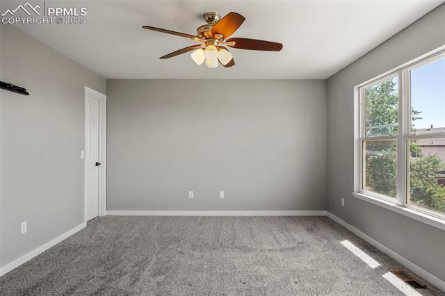 8035 Ferguson Road Peyton, CO 80831 - Photo 23 of 28 Spare room with carpet and ceiling fan