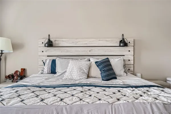 a bedroom with a bed and with a window