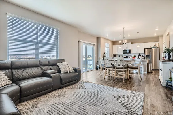 a kitchen with kitchen island granite countertop a white cabinets and stainless steel appliances