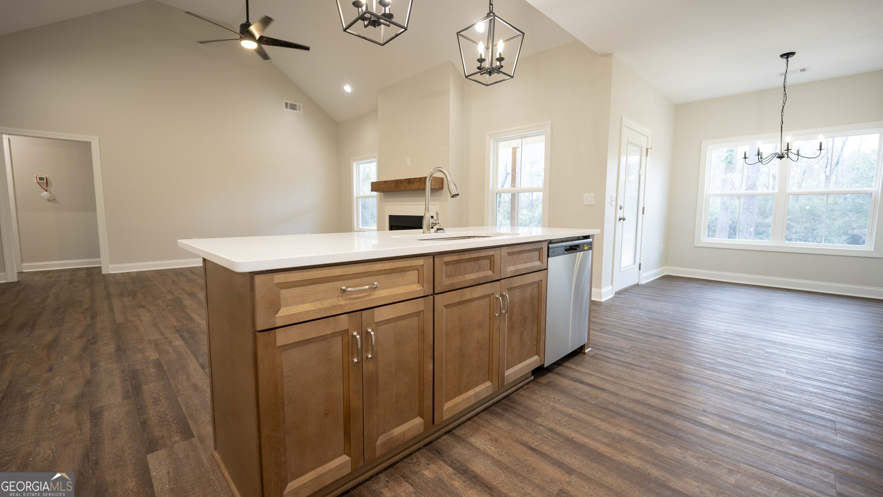 288 Frank Cook Road Cochran, GA 31014 - Photo 12 of 40 a kitchen with a sink window and wooden floor