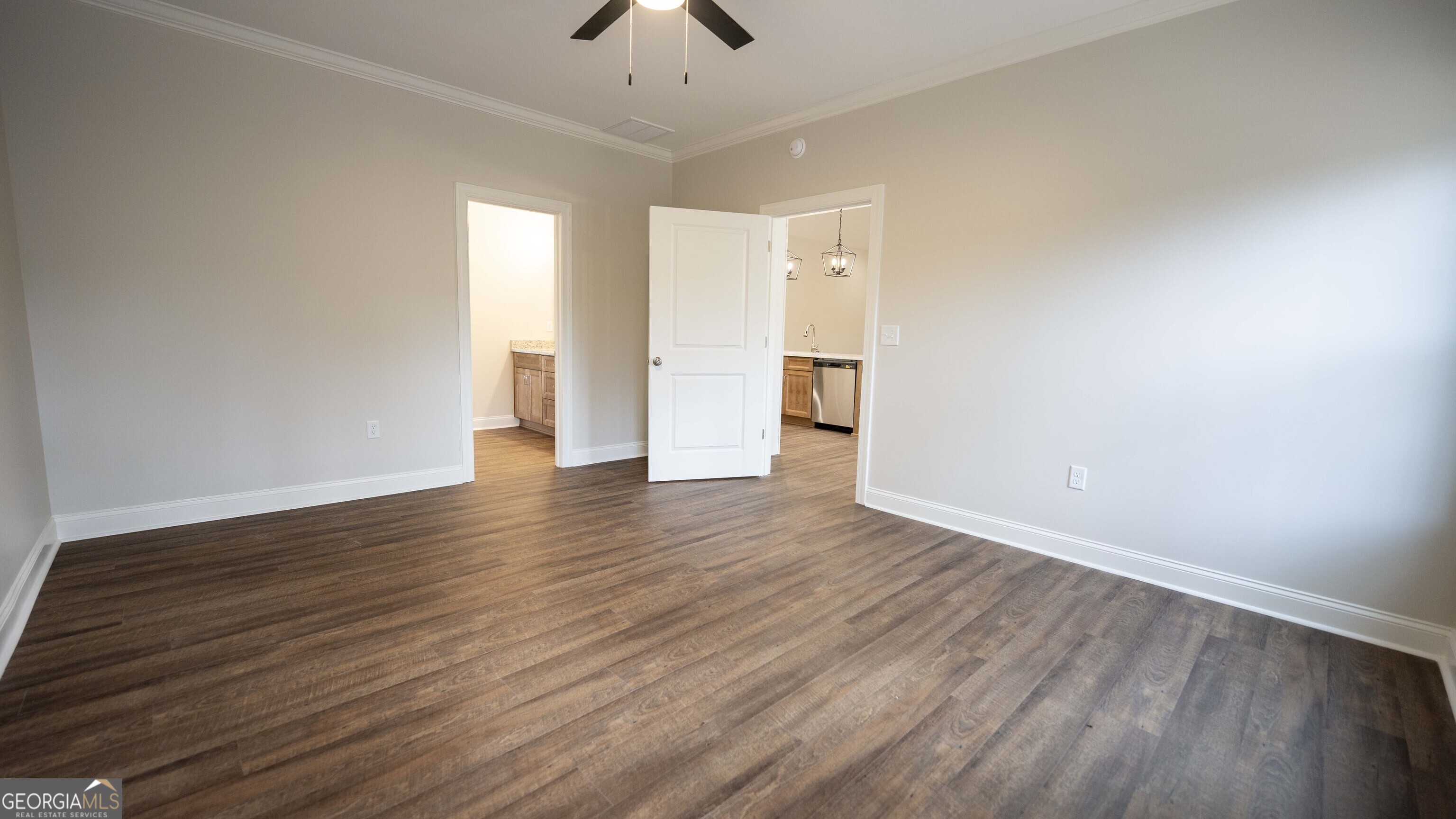 288 Frank Cook Road Cochran, GA 31014 - Photo 14 of 40 a view of an empty room with wooden floor