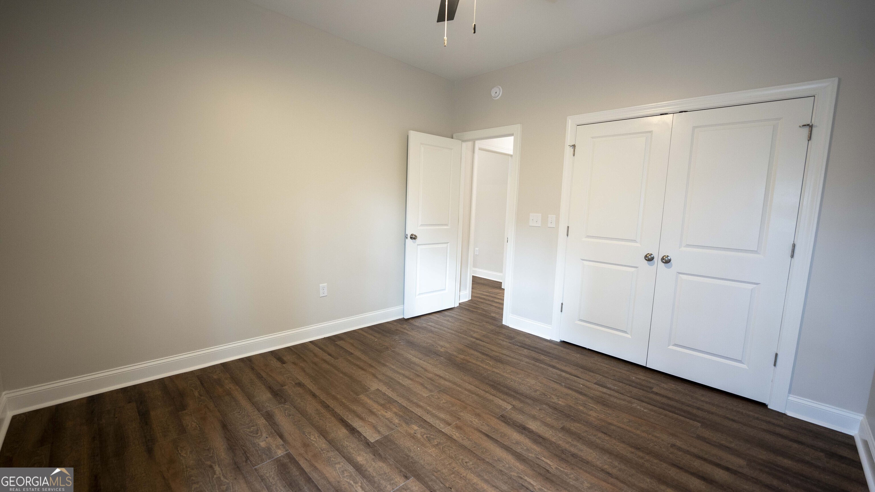 288 Frank Cook Road Cochran, GA 31014 - Photo 20 of 40 a view of an empty room with wooden floor