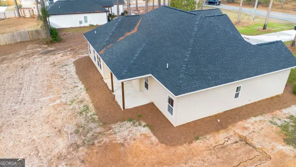 a view of a house with a yard and garage