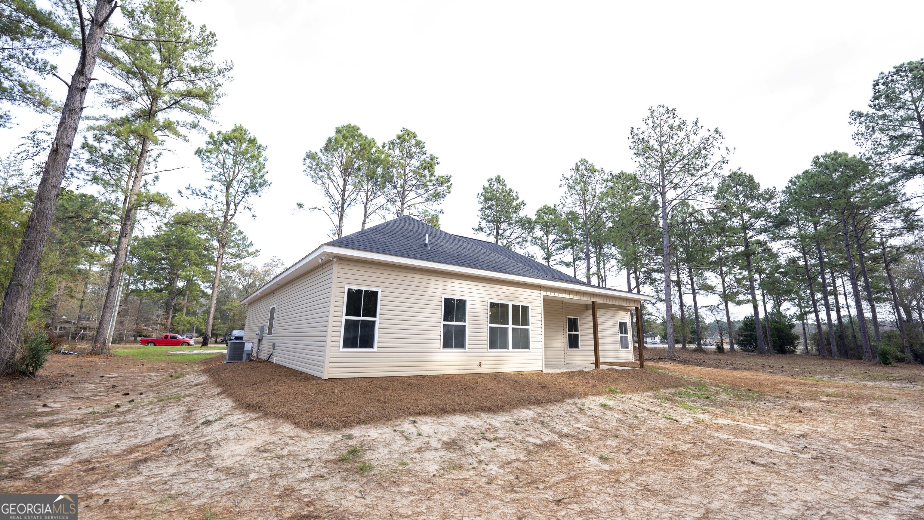 288 Frank Cook Road Cochran, GA 31014 - Photo 36 of 40 a view of a yard in front of a house with large trees