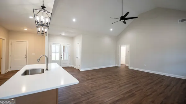 a view of a kitchen counter space a sink and appliances