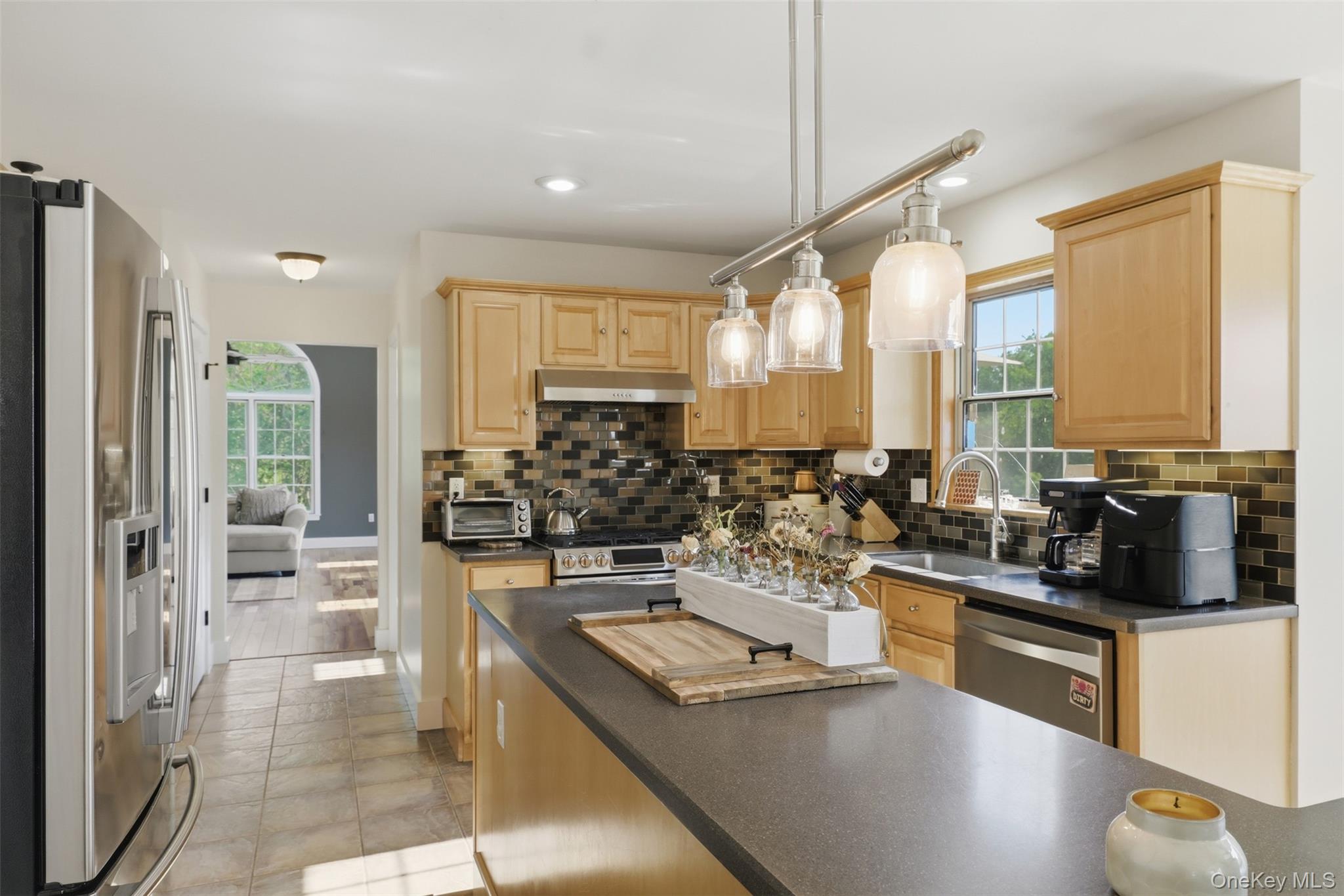 233 Devon Farms Road Stormville, NY 12582 - Photo 19 of 48 a kitchen with stainless steel appliances kitchen island granite countertop a stove and white cabinets