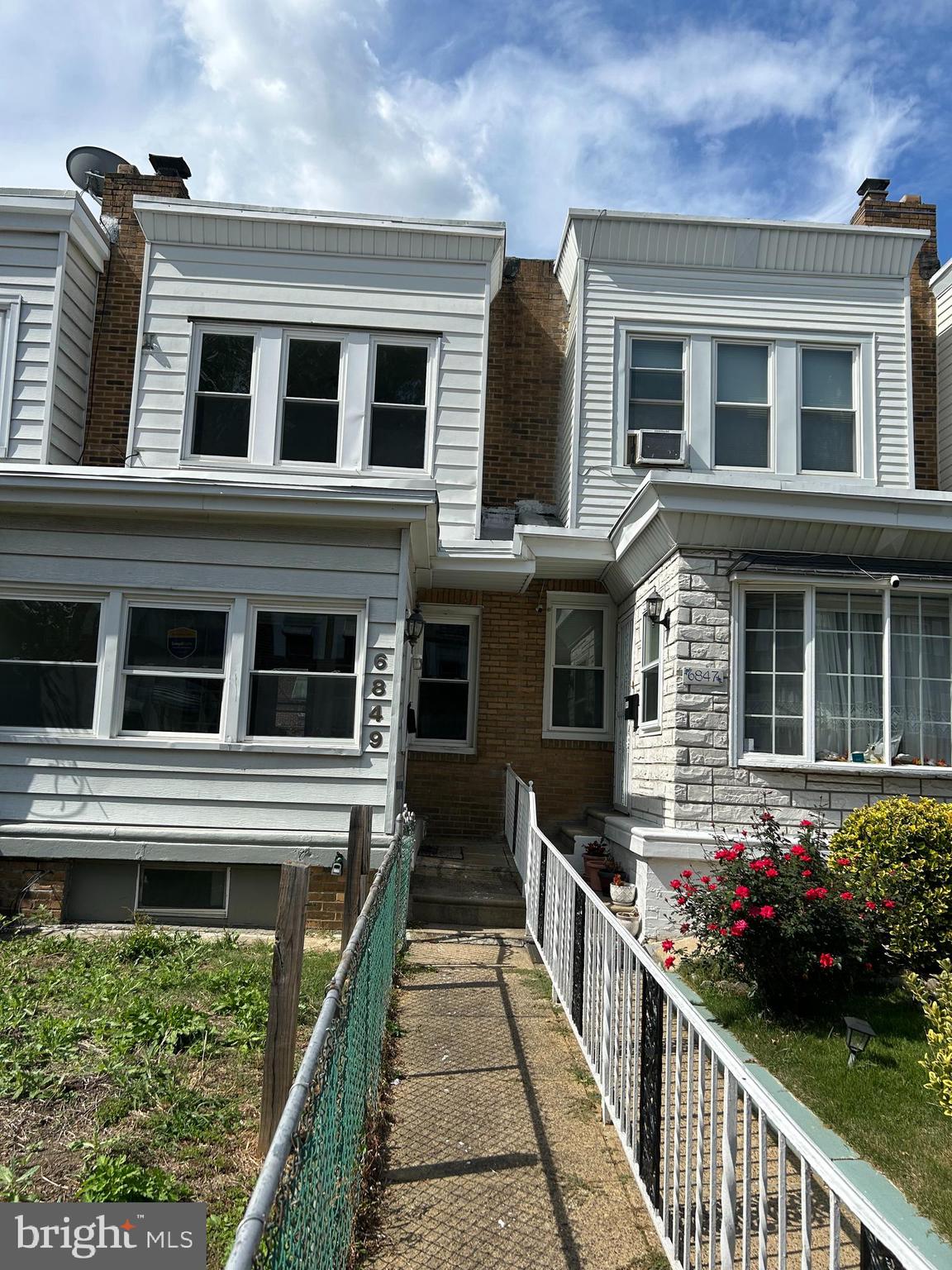 6849 Regent Street Philadelphia, PA 19142 - Photo 4 of 5 a front view of a house with a yard