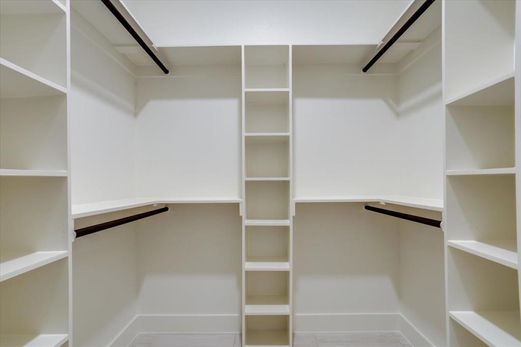 1507 Elk Creek Road Dallas, TX 75253 - Photo 20 of 40 a view of walk in closet with empty racks