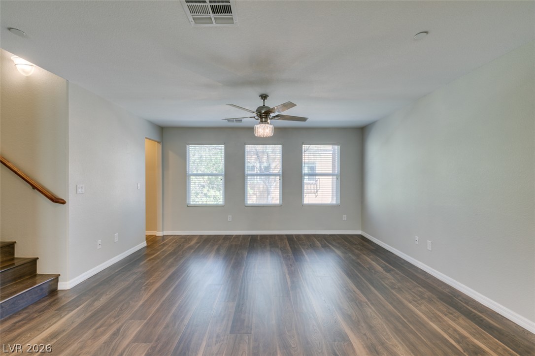 4650 Ranch House Road, Unit 46 North Las Vegas, NV 89031 - Photo 12 of 38 Gleaming hardwood floors and a row of classic windows anchor this airy main living area.