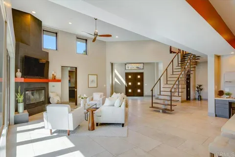 a spacious bedroom with a bed and a large window