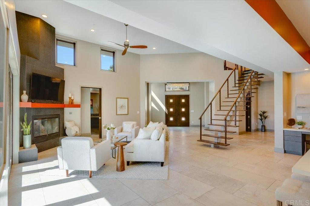 5382 Willman Way Fallbrook, CA 92028 - Photo 14 of 64 a living room with furniture and a flat screen tv