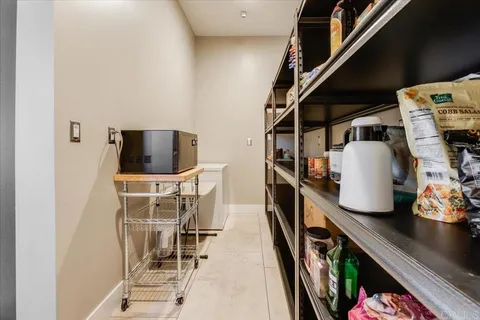 a large bathroom with a granite countertop tub a sink a mirror and a shower