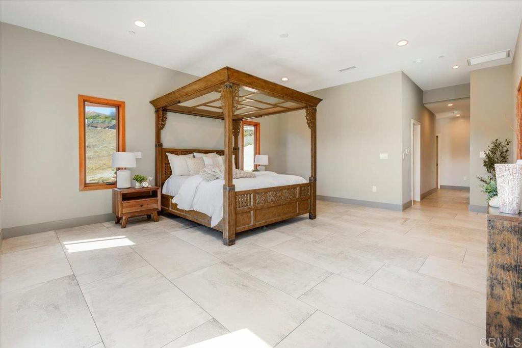 5382 Willman Way Fallbrook, CA 92028 - Photo 19 of 64 a bedroom with a bed and a window