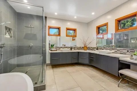 a bedroom with a bed and a chair