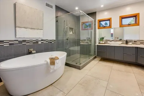 a view of a balcony with wooden floor and fence