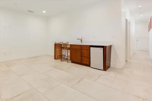 an aerial view of a house with swimming pool lawn chairs and yard
