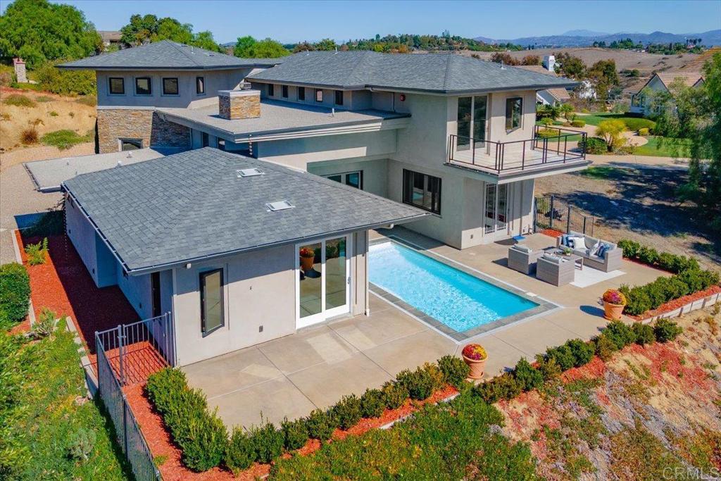 5382 Willman Way Fallbrook, CA 92028 - Photo 40 of 64 an aerial view of a house with swimming pool lawn chairs and yard