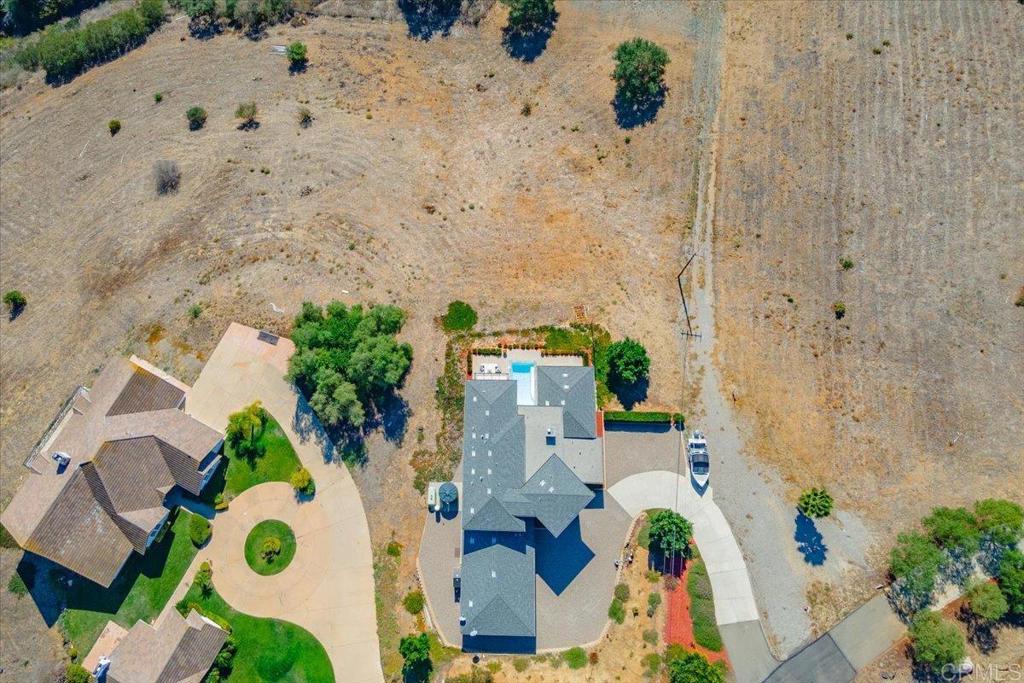 5382 Willman Way Fallbrook, CA 92028 - Photo 56 of 64 an aerial view of a house with a yard and a large tree